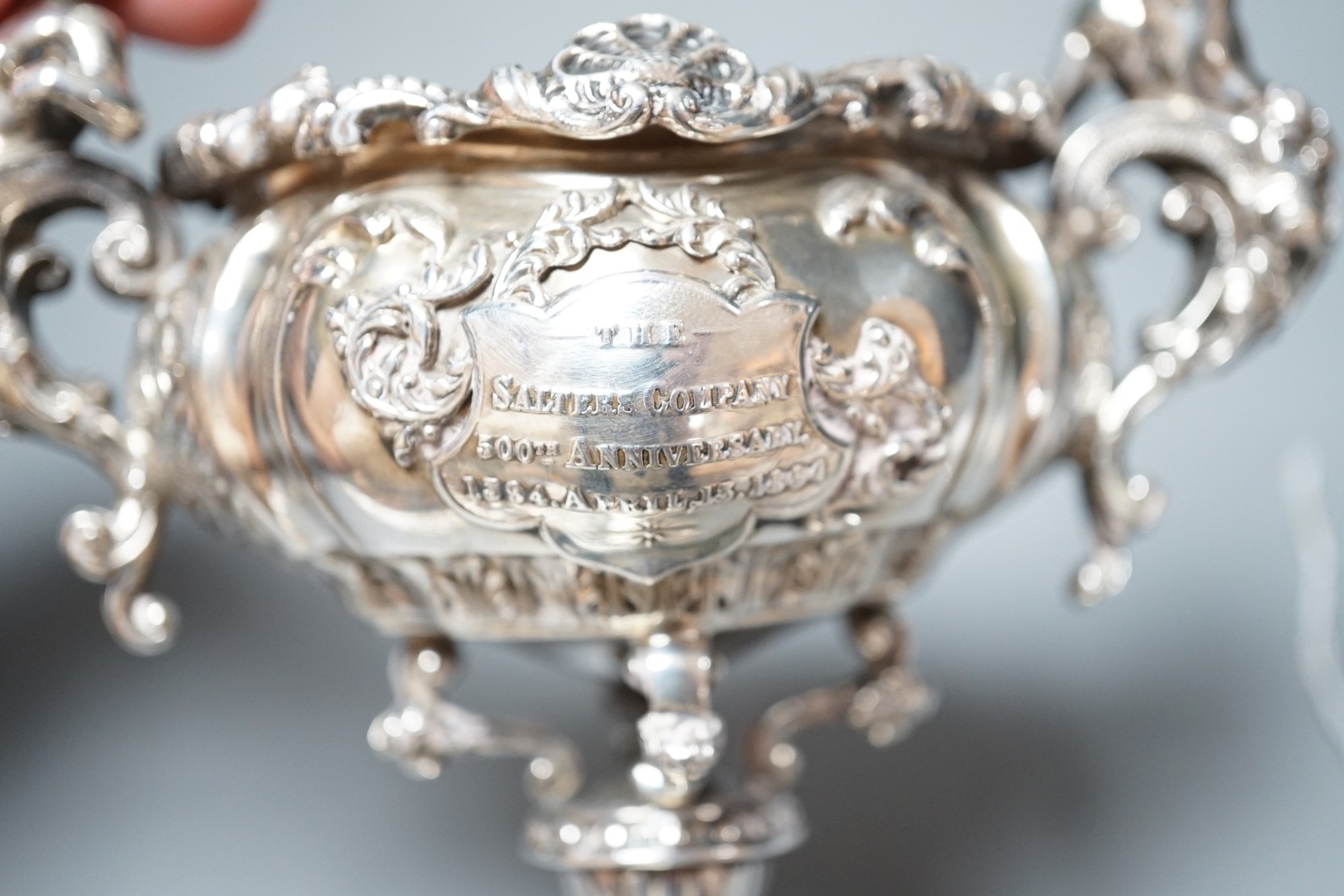 A late Victorian ornate small silver presentation centrepiece, by Carrington & Co, London, 1893, inscribed 'The Salter's Company 500th Anniversary, 1394 April 13th 1894', height 15.1cm, 11.5oz.